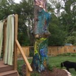 storm-damaged tree with painting