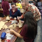 A group of people working on a project in a classroom.