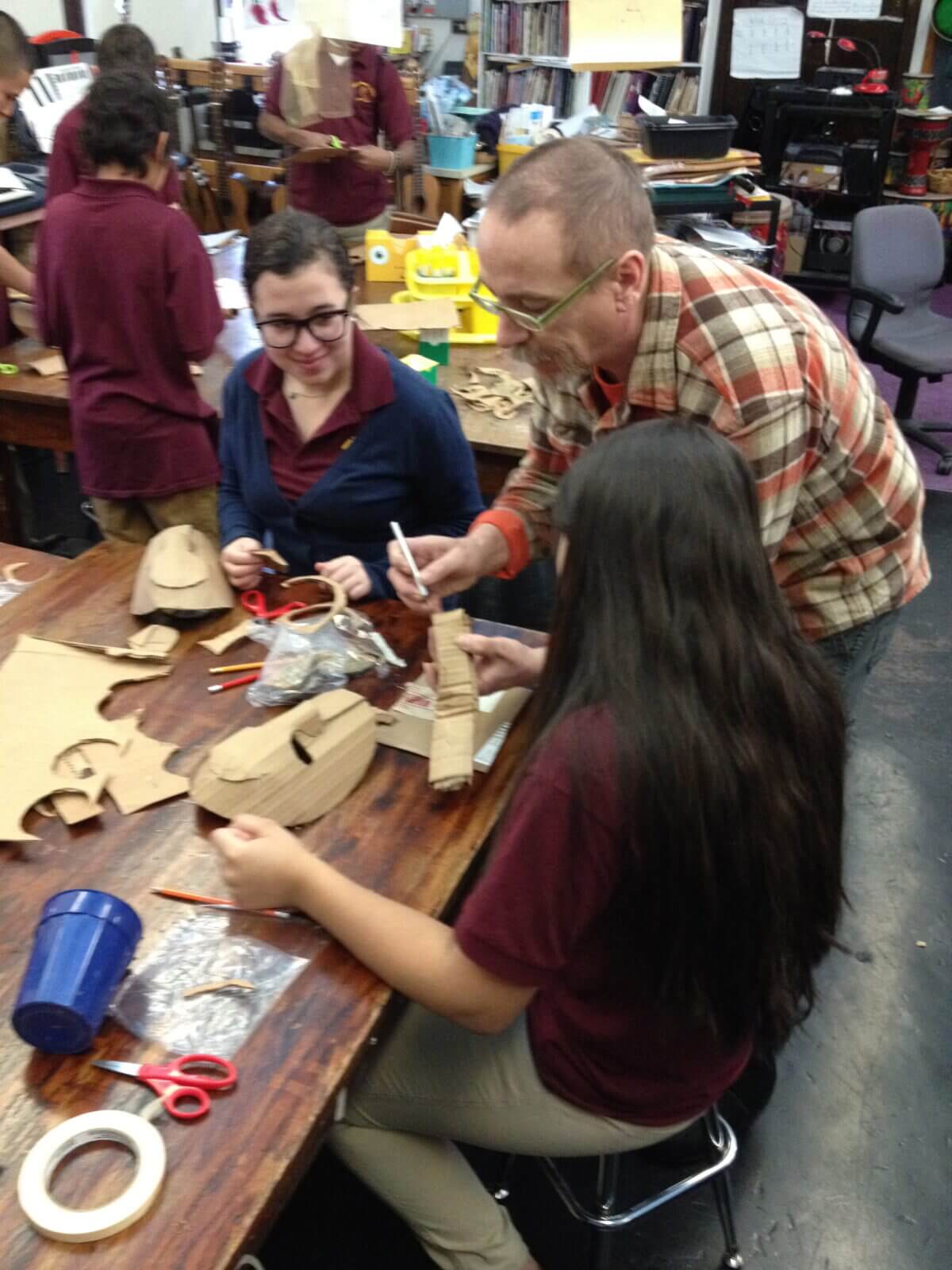 A group of people working on a project in a classroom.