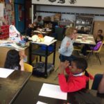 A group of children in a classroom.