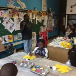 A group of children in a classroom.