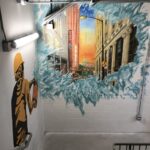 Colorful urban mural in stairwell.