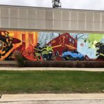 Firefighter mural depicting rescue and emergency scenes.