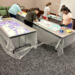 interns painting mini murals